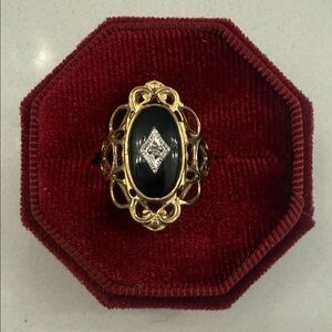 Elegant Gold and Black Ring